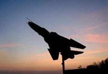 Russian Strike Hits Sumy Civilians Silhouette of a fighter jet mounted on a pedestal at sunset
