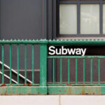 Fatal Subway Stabbing Sparks Safety Fears Subway entrance with a green railing and a sign reading Subway