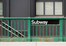 Fatal Subway Stabbing Sparks Safety Fears Subway entrance with a green railing and a sign reading Subway
