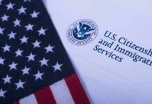 Feds Nuke Illinois Aid For Illegals American flag beside U.S. immigration document