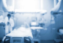 Medical Mistake Ends In Tragedy Blurred image of a medical professional in a hospital setting
