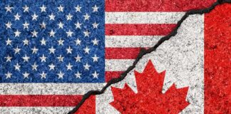 Trade War With Canada Intensifies Again USA and Canada flags with a cracked border