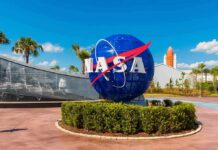 Viral Moon Tale Meets Cold Records NASA globe sign at visitor complex entrance