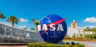 Viral Moon Tale Meets Cold Records NASA globe sign at visitor complex entrance