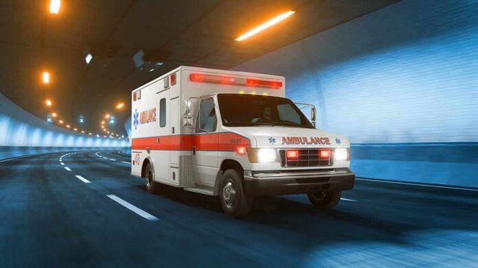 shutterstock_1159851319 Ambulance driving through a tunnel with emergency lights on