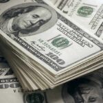 Stack of US 100 dollar bills