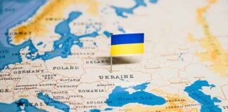 Ukraine flag pin on a map of Eastern Europe