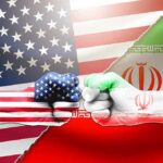 US and Iran flag fists bumping against split flags