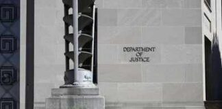 FBI Brings Fugitive Back From Qatar Department of Justice building exterior with stone facade and plants