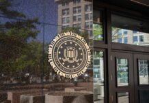 DOJ Faces Pressure Over Fetal Remains FBI seal on a building entrance