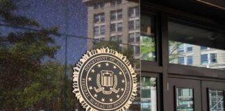 DOJ Faces Pressure Over Fetal Remains FBI seal on a building entrance