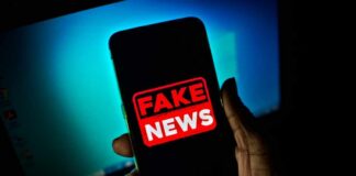 Elite Murder Tale Exposed As Total Fake Smartphone screen showing a bold fake news warning