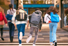 School Zone Horror Nearly Unfolds Group of children walking together with backpacks in an urban area