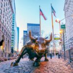 BlackRock CEO Sounds New York Alarm Bronze charging bull sculpture in a city street