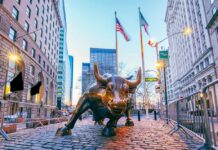 BlackRock CEO Sounds New York Alarm Bronze charging bull sculpture in a city street