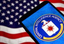 CIA logo displayed on a smartphone with an American flag background