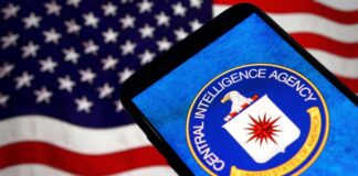CIA logo displayed on a smartphone with an American flag background
