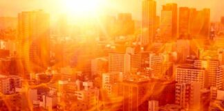 West Faces Relentless Heat Dome City skyline under intense heat with flames overlay