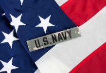 What Happened Aboard USS Anchorage? Close-up of an American flag with a U.S. Navy insignia