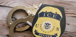 Big Number, Bigger Doubts — ICE Under Fire ICE officer badge next to handcuffs on a wooden surface