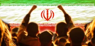 Tehran Funeral Features Anti-US Chants Crowd of people raising their fists in front of the Iranian flag