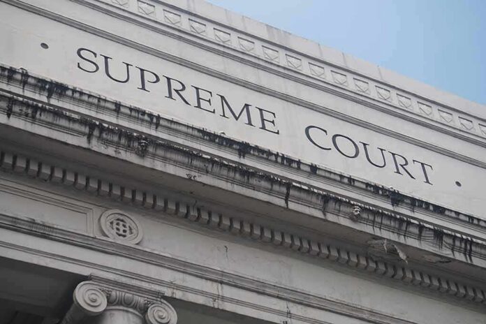 shutterstock_1037220052-1 Supreme Court building facade with classical columns