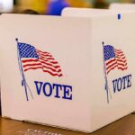 Name-Game Chaos Hits Alaska Ballot voting booth with American flag graphics