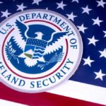 Border Chaos? DHS Points Finger At Congress U.S. Department of Homeland Security seal on American flag