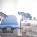 Massachusetts Passes Late-Term Abortion Bill Gynecological exam chair with blue padding in a clinic room