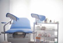 Massachusetts Passes Late-Term Abortion Bill Gynecological exam chair with blue padding in a clinic room