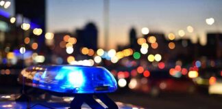 Florida Teen Vanishes After Midnight Exit Police car light bar flashing at dusk