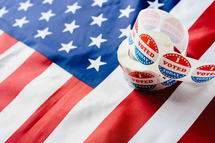 Roll of I Voted stickers on an American flag