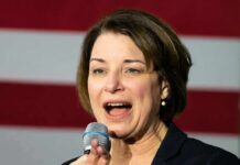 Woman speaking into a microphone