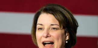 Woman speaking into a microphone
