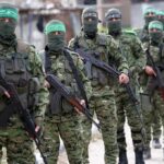 Trump’s Bold Play: Gaza Without Guns? Armed men in camouflage uniforms standing in a line