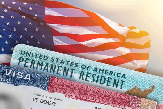shutterstock_1834985749 U.S. flag with visa and permanent resident cards