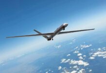 Unmanned aerial drone flying high above clouds