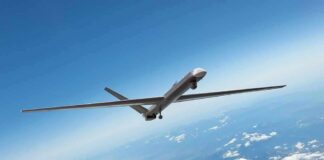 Why Are Spy Planes Circling The Border? Unmanned aerial drone flying high above clouds