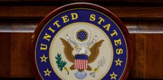 DSA’s Power Play: Erase The Senate United States Senate seal on a wooden wall