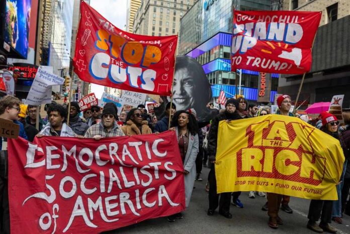 New,York,City,,New,York,Usa,-,March,28,2026 Protesters holding large banners at a city street demonstration