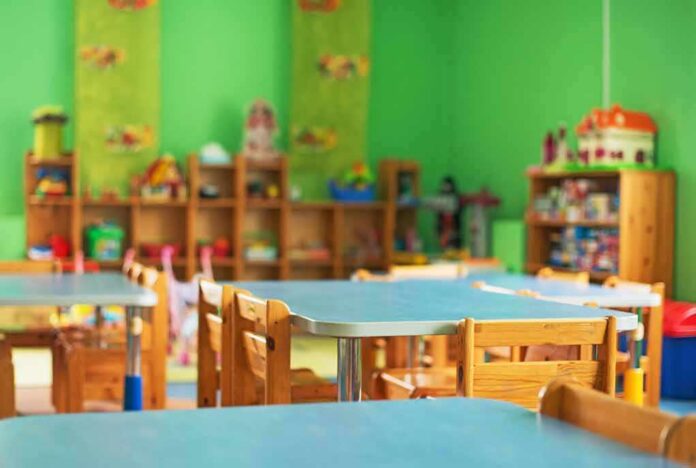 shutterstock_511391014 Preschool classroom with small tables and wooden chairs