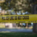 Staged Hanging Shocker Rattles Mississippi yellow police tape cordoning off an outdoor area