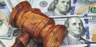 Taxpayer Cash Covers ICE Detentions? Wooden judge's gavel on scattered US dollar bills