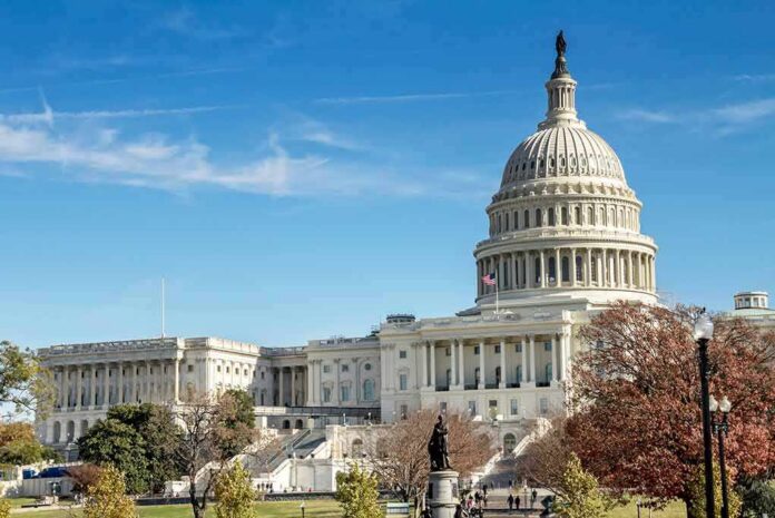 shutterstock_1039171084 United States Capitol building with dome and autumn trees