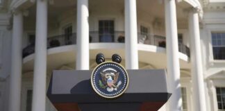 Presidential podium with seal in front of white-columned building