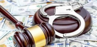 Court Misled — Accused MS-13 Murderer Released Judge's gavel and handcuffs on pile of US dollar bills