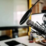 Shock Lawsuit Targets Streamer’s Israel Rant Podcast microphone with pop filter on desk