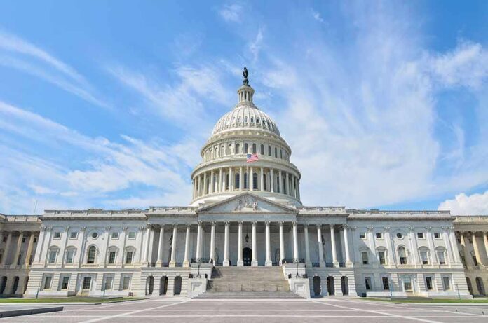 shutterstock_113019124 United States Capitol building with dome under a blue sky