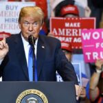 Rearrest Shock Fuels Trump’s NC Broadside politician speaking at rally podium