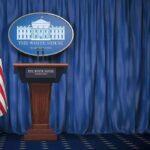 Press Access Meltdown Erupts at White House White House press briefing podium with U.S. flag and blue curtain